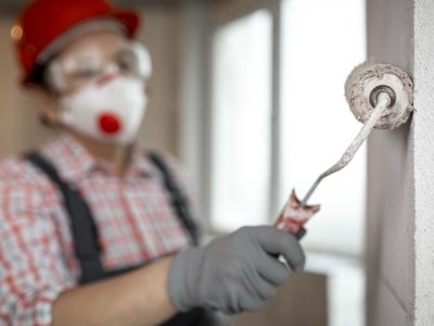 female-construction-worker-with-helmet-paint-roller female-construction-worker-with-helmet-paint-roller